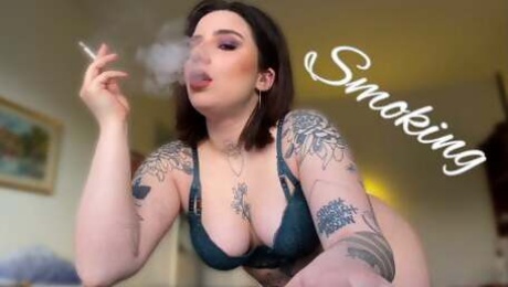 Sexy smoking alternative tattooed model in lingerie